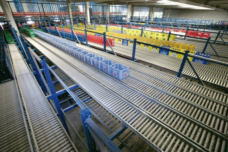 Roller conveyor systems carrying crates of drinks in production lines.