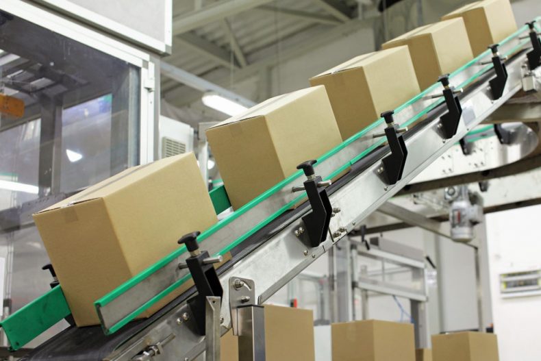 Belt conveyors transporting boxes in a warehouse
